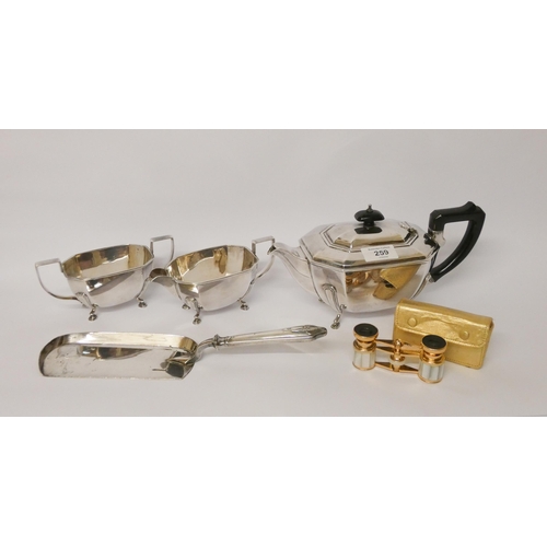 259 - A three piece silver plated vintage tea service, crumb scoop and a pair of opera glasses with case