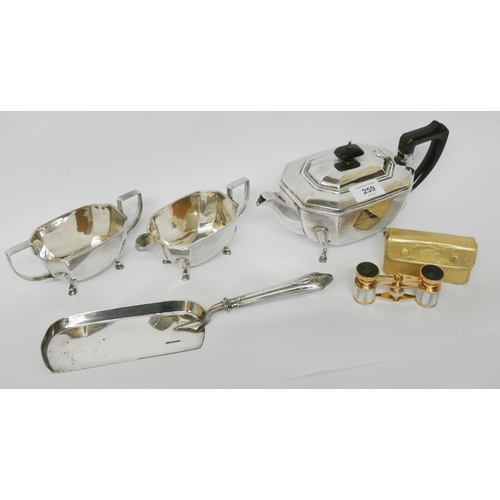 259 - A three piece silver plated vintage tea service, crumb scoop and a pair of opera glasses with case