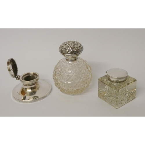 432 - A hallmarked silver capstan inkwell, a further inkwell with silver lid and a cut glass scent bottle ... 