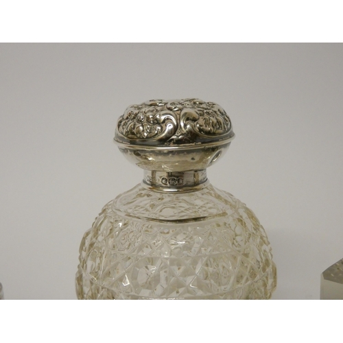 432 - A hallmarked silver capstan inkwell, a further inkwell with silver lid and a cut glass scent bottle ... 