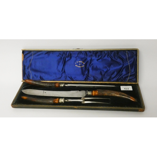 433 - A country house carving set with antler handles