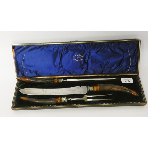 433 - A country house carving set with antler handles