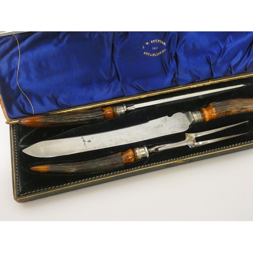 433 - A country house carving set with antler handles