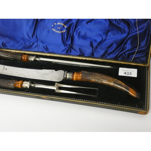 433 - A country house carving set with antler handles