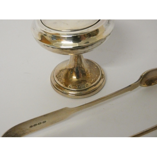 436 - A pair of hallmarked silver sugar nips, three silver spoons and a silver dressing table jar