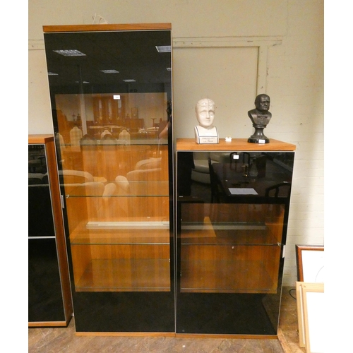 220 - Two contemporary teak glazed display cabinets each 2'6 wide, one is 7' tall the other 4'9 tall