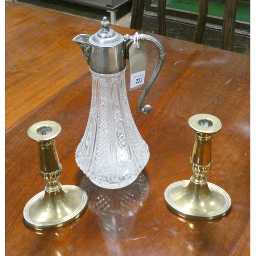 222 - A pair of antique brass candlesticks and a brass and plated claret jug