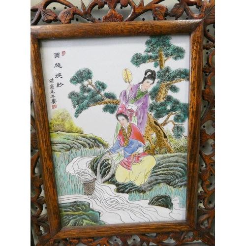 251 - A Japanese porcelain plaque in pierced hardwood frame, measurement overall 20