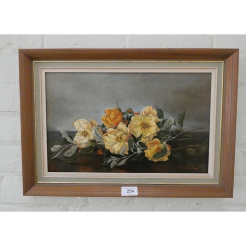 254 - An Ursula Dunlop oil on canvas floral still life of yellow saga roses, signed lower right, image siz... 