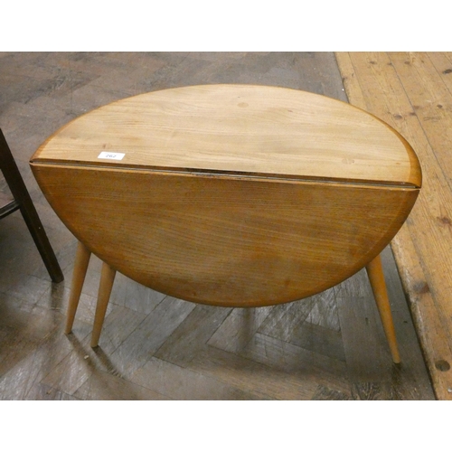 262 - An Ercol blonde elm circular single drop leaf coffee table