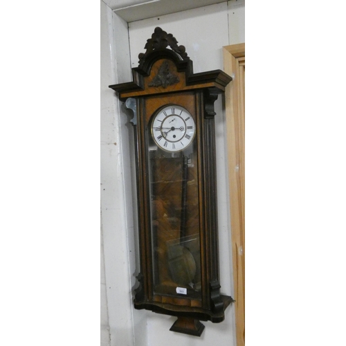 303 - A Victorian Vienna wall clock in walnut ebonised and glazed case