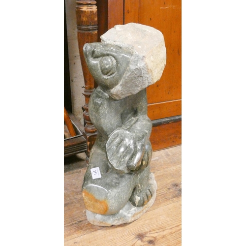 311 - A carved green stone figure ornament, 20