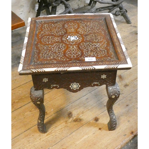 320 - A Moorish style carved and mother of pearl inlaid low square occasional table, fitted drawer