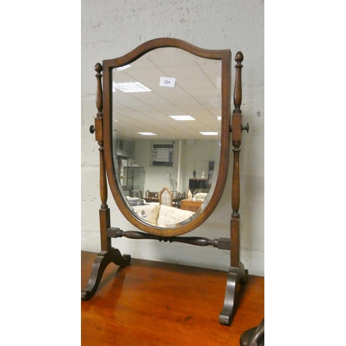 324 - A Georgian style shield shaped mahogany swing toilet mirror