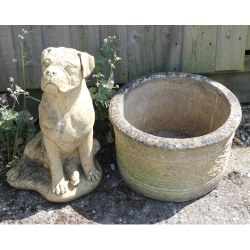 803 - A reconstituted stone figure of a dog and circular garden planter