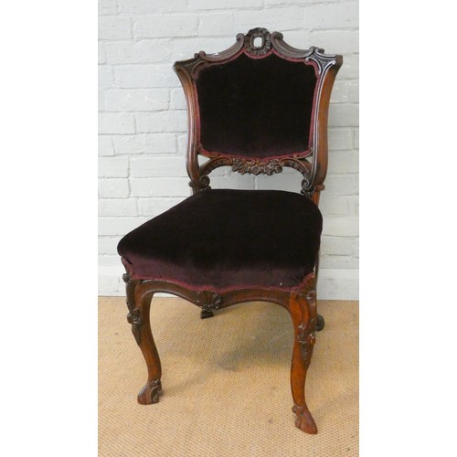 351 - A Victorian rosewood occasional chair with shell carving upholstered in royal purple velvet