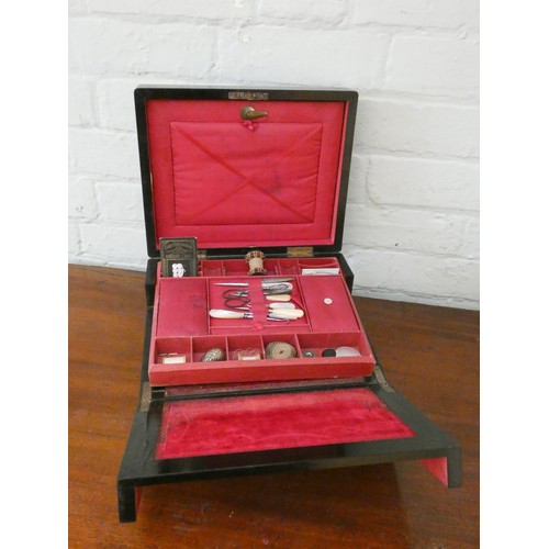 354 - A Victorian rosewood work box with various sewing materials, lift out compartments with writing slop... 