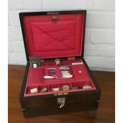 354 - A Victorian rosewood work box with various sewing materials, lift out compartments with writing slop... 