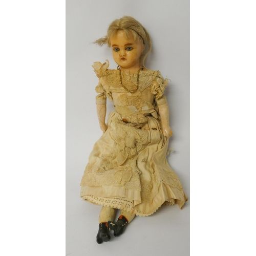 337 - A Victorian waxed head doll with fabric body and composition arms and legs