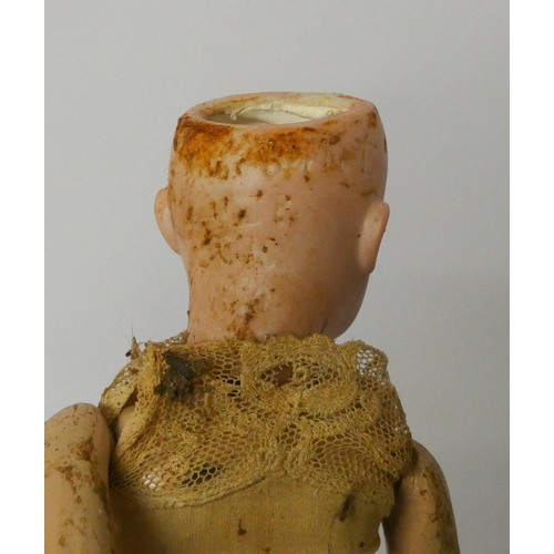 338 - Two miniature bisque head dolls - one has a small crack