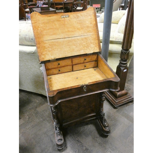 340 - A Victorian walnut davenport with birds eye maple lined interior with inset leather top