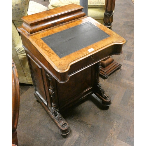 340 - A Victorian walnut davenport with birds eye maple lined interior with inset leather top