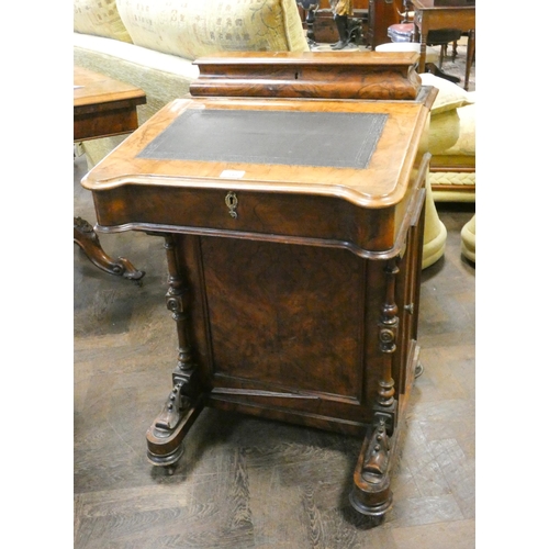 340 - A Victorian walnut davenport with birds eye maple lined interior with inset leather top