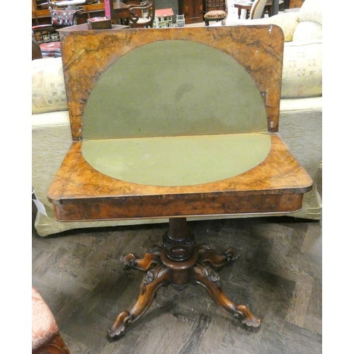 341 - A Victorian burr walnut fold old topped card table on centre pillar and Quadra form base