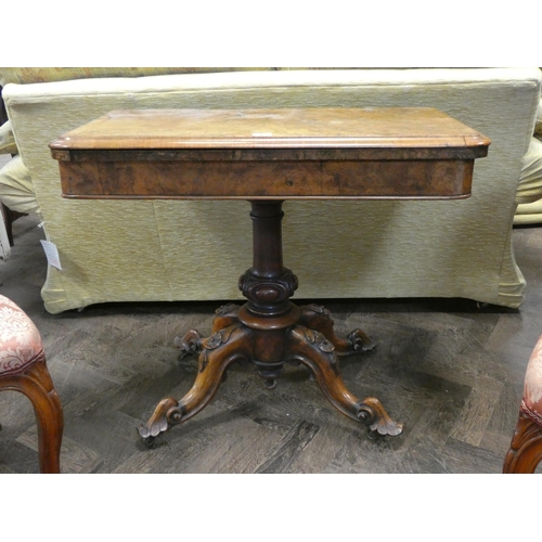 341 - A Victorian burr walnut fold old topped card table on centre pillar and Quadra form base