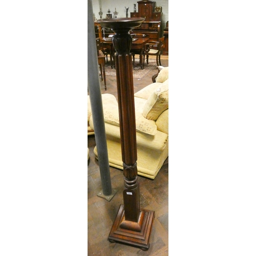 346 - A carved column mahogany torchiere standing on a square base approximately 5' tall