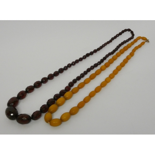 471 - A long vintage row of faceted cherry amber beads and another row of amber beads.