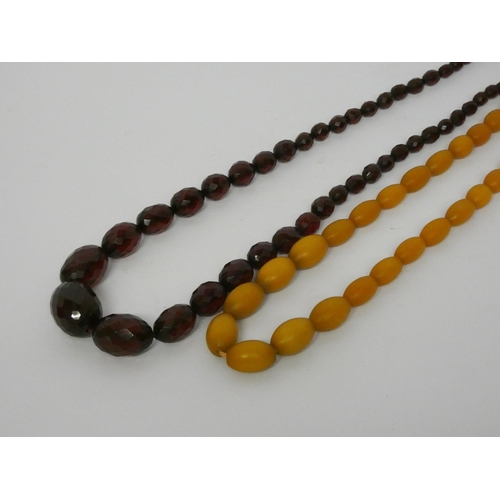 471 - A long vintage row of faceted cherry amber beads and another row of amber beads.