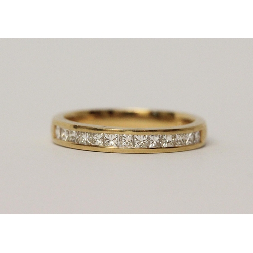 498 - 18ct yellow gold princess cut diamond channel set half hoop eternity ring, size N, 3.5gms