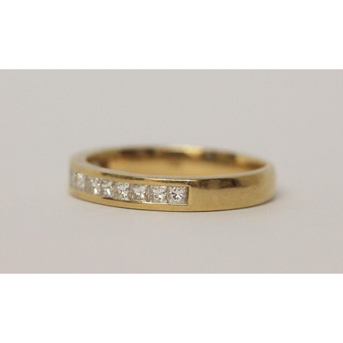 498 - 18ct yellow gold princess cut diamond channel set half hoop eternity ring, size N, 3.5gms