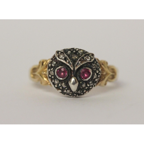 503 - An antique ruby and diamond cluster ring formed in the shape of an owls head on unmarked yellow gold... 