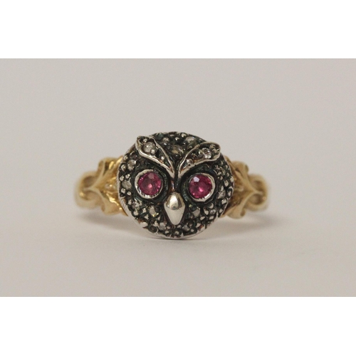 503 - An antique ruby and diamond cluster ring formed in the shape of an owls head on unmarked yellow gold... 