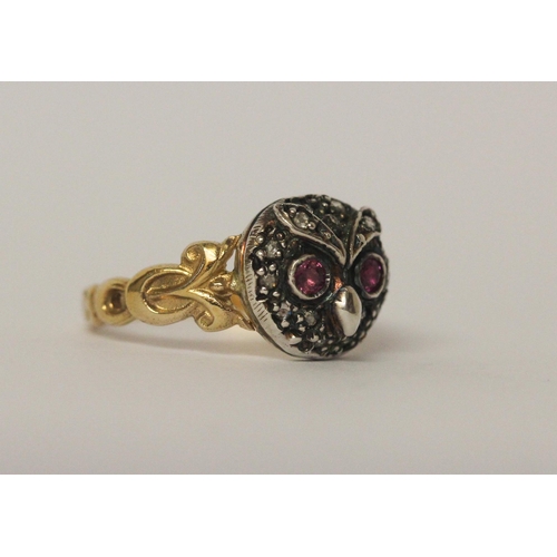 503 - An antique ruby and diamond cluster ring formed in the shape of an owls head on unmarked yellow gold... 