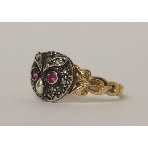 503 - An antique ruby and diamond cluster ring formed in the shape of an owls head on unmarked yellow gold... 