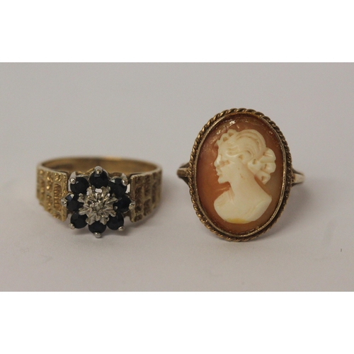 513 - Two 9ct gold dress rings - one a sapphire cluster the other a Cameo ring. Both size P, weight 7.3g