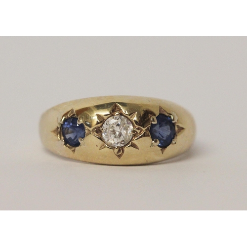 517 - A 9ct yellow gold sapphire and CZ three stone gypsy ring, size U, 4.5gms