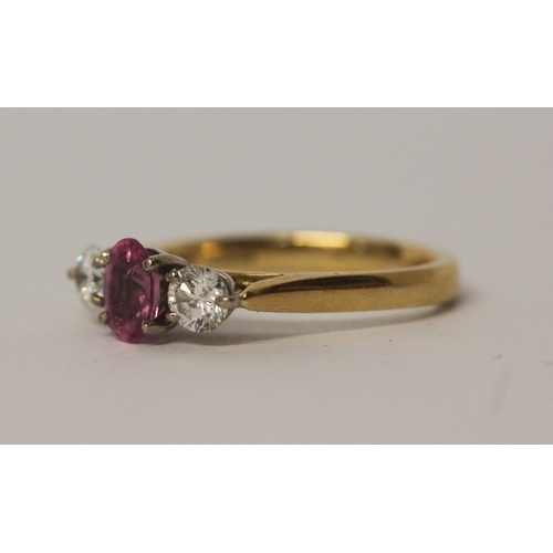 521 - 18ct gold three stone pink sapphire and diamond ring, hallmarked, ring size L, 3.7gms