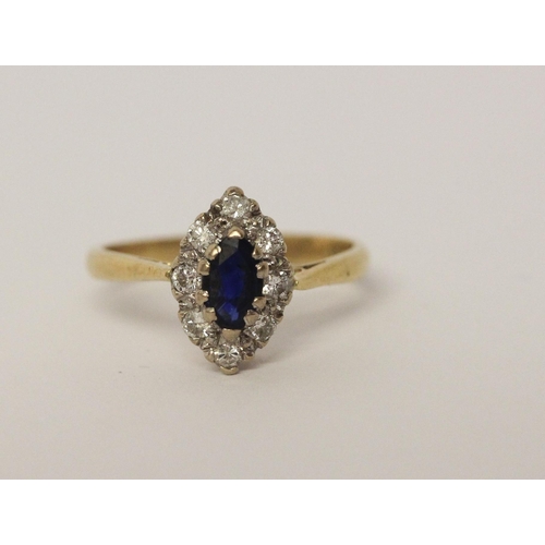 530 - A sapphire and diamond marquise shaped cluster ring, hallmarked 18ct gold shank, ring size L, 3.2gms