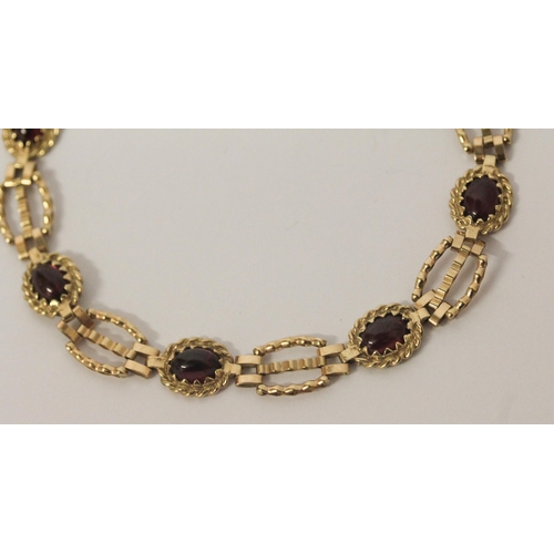 535 - 9ct gold cabochon garnet linked panel bracelet, 6gms