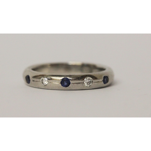 544 - Modern platinum sapphire and diamond wedding band, stones in a rub over setting, hallmarked, ring si... 