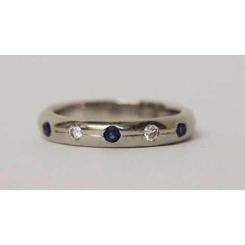 544 - Modern platinum sapphire and diamond wedding band, stones in a rub over setting, hallmarked, ring si... 