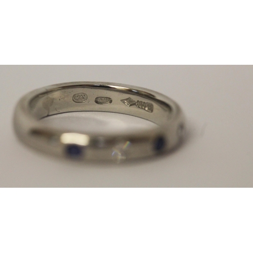 544 - Modern platinum sapphire and diamond wedding band, stones in a rub over setting, hallmarked, ring si... 