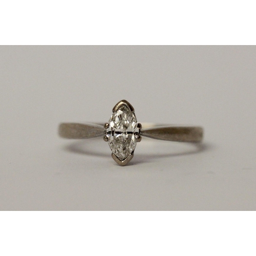 545 - Modern diamond engagement ring, set with a marquise diamond weighing approximately 60 pts, hallmarke... 