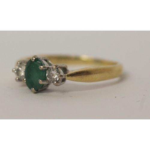 546 - Emerald and diamond three stone ring, hallmarked yellow gold band, ring size P, 3.5gms