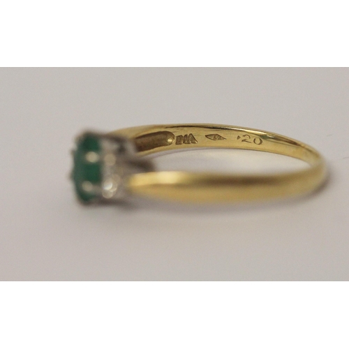 546 - Emerald and diamond three stone ring, hallmarked yellow gold band, ring size P, 3.5gms