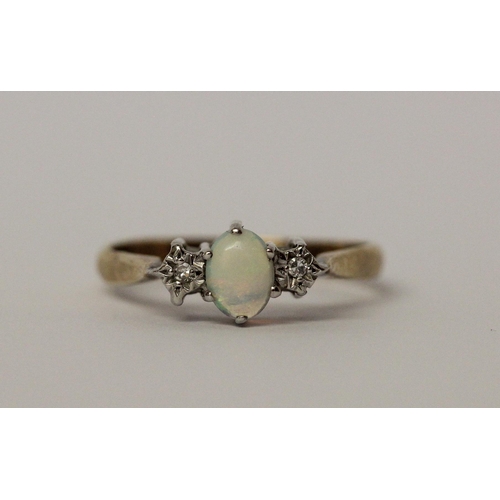 547 - An opal and diamond three stone ring on hallmarked 9ct gold band, ring size P, 2gms